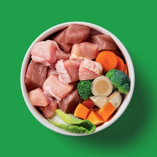 Raw 3 Bird Roast 500g - Christmas Limited Edition with turkey, pheasant & veggies on a green background.