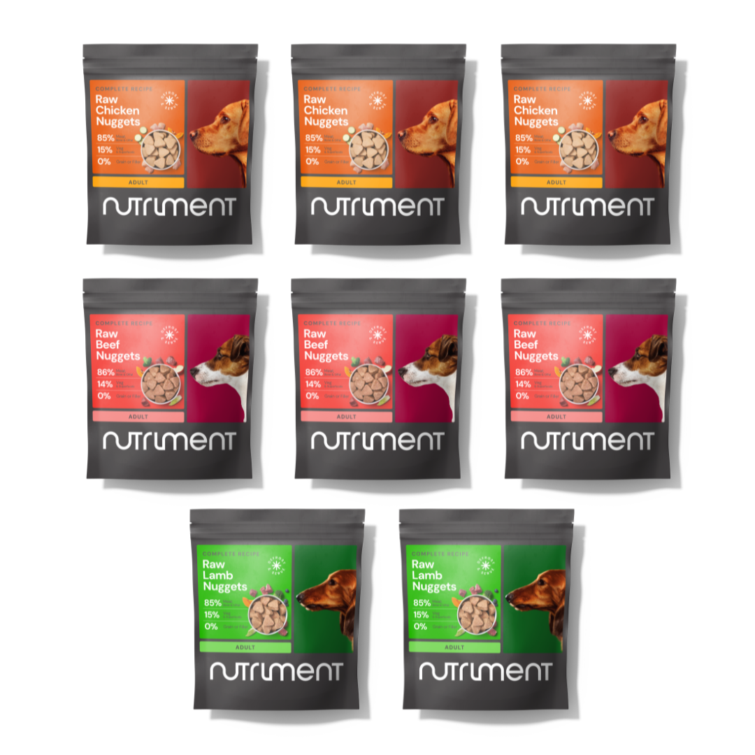 Nine packages of Nutriment raw dog food nuggets in different flavors on a white background.