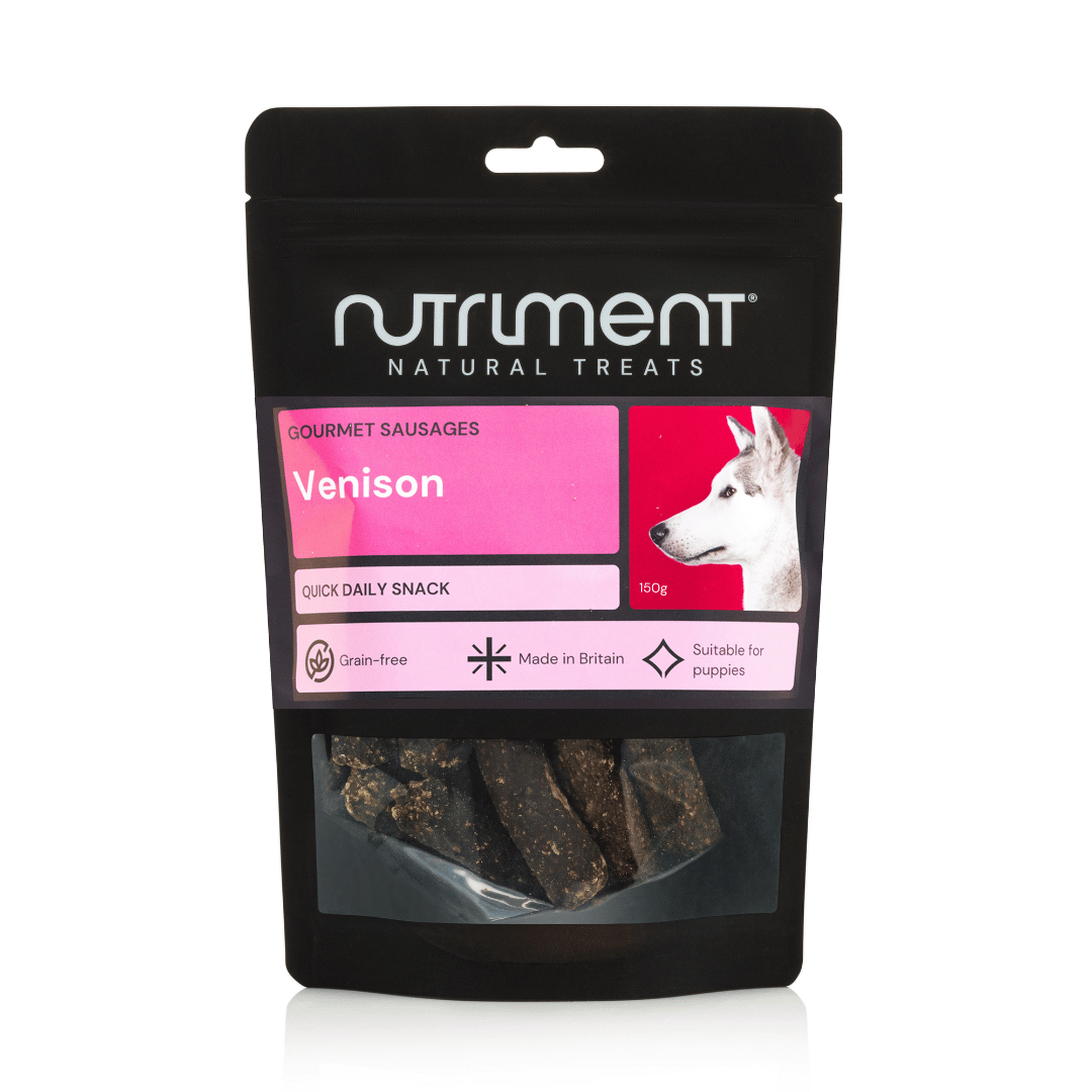 A black bag of Venison Gourmet Sausages 150g dog treats with a white dog and pink label on the front.
