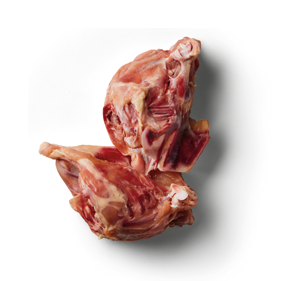 Chicken Carcasses 700g on a white backdrop, displaying hues of red and pink.