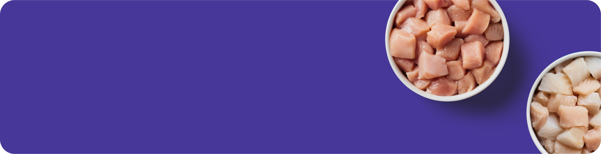 Two bowls of raw diced chicken pieces are placed on the right side of a purple background.