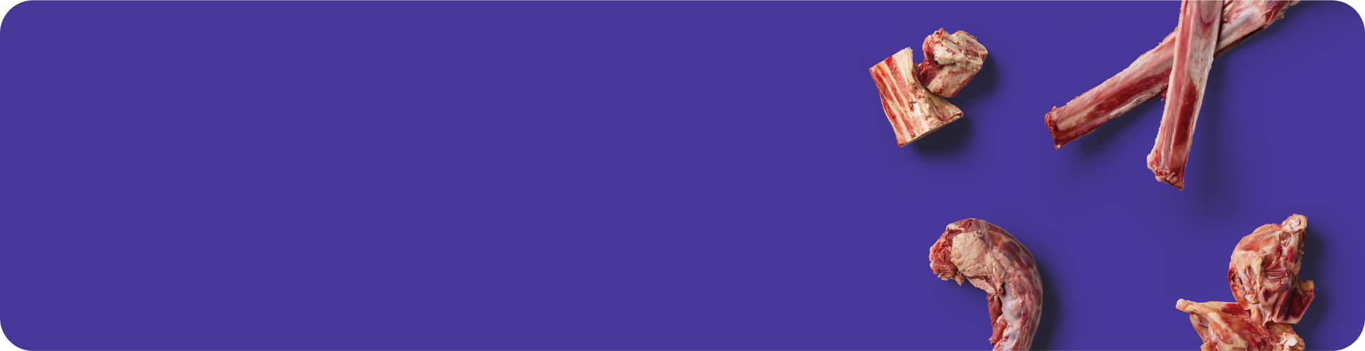 Several raw pieces of meat with bones are scattered on the right side of a purple background, leaving a large empty space on the left.