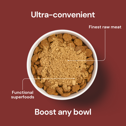A bowl of kibble with Freeze Dried Topper - Chicken 50g showcases raw pet food and functional superfoods.