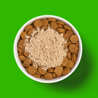 Freeze Dried Topper - Lamb 50g dry food bowl highlights freeze dried lamb benefits on a bright green background.
