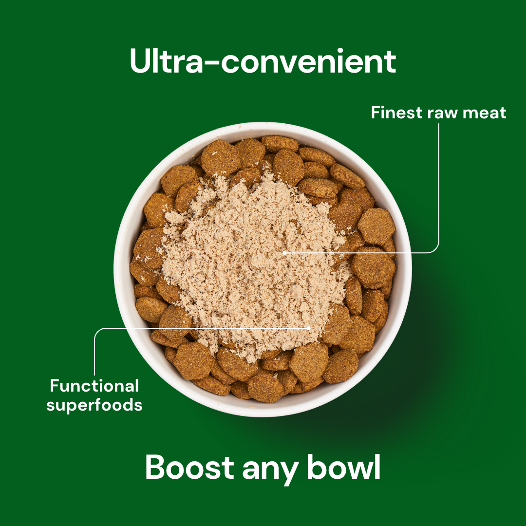 A bowl of dry pet food topped with Freeze Dried Topper - Lamb 50g, labeled "finest raw meat" and "superfoods.