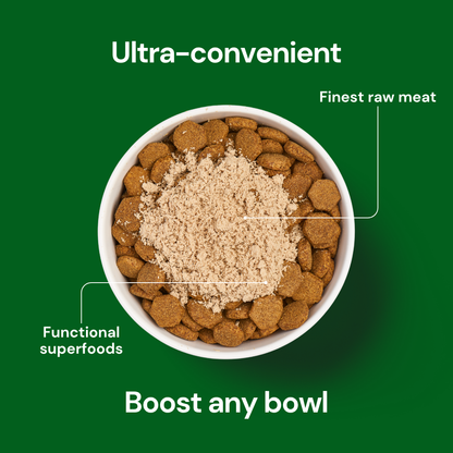 A bowl of dry pet food topped with Freeze Dried Topper - Lamb 50g, labeled "finest raw meat" and "superfoods.