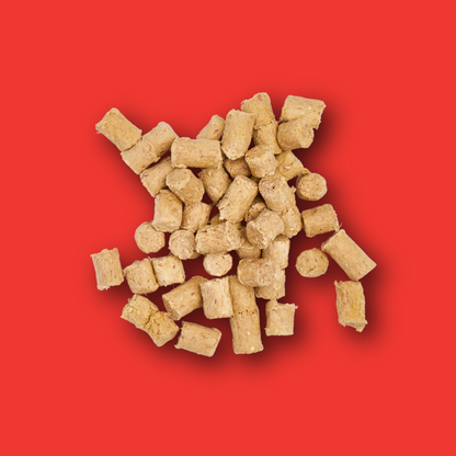 Freeze Dried Treats - Beef 30g: light brown, cylindrical pellets on a solid red background.