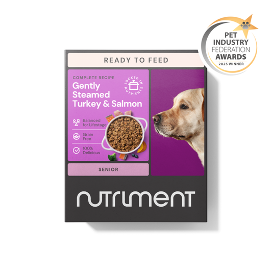 A box of Senior Gently Steamed Turkey & Salmon 395g dog food, featuring a dog's face and award badge.