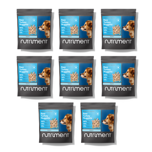 Eight bags of 8kg Puppy Nugget Starter Pack, arranged in two rows on a white background.