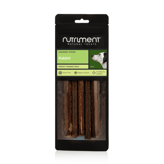 A black pack of Rabbit Gourmet Sticks Pack Of 4 dog treats with green label and product details.