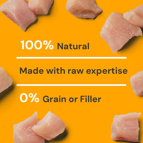 Chunks of premium chicken on orange: Cat Chicken Dinner 175g - All Natural, Expertly Raw, No Grains or Fillers.